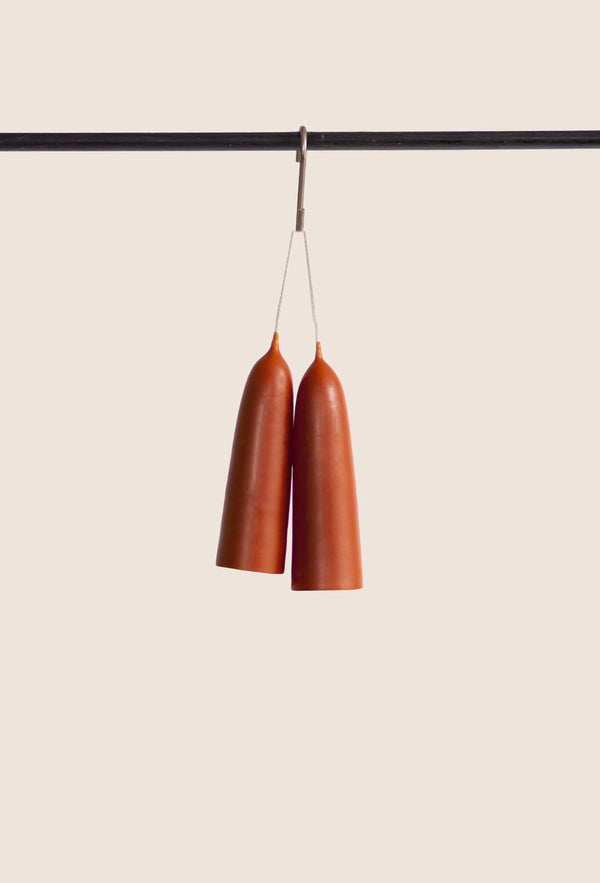 Pair of poppy red colour candles hanging made from beeswax, Ondine Ash