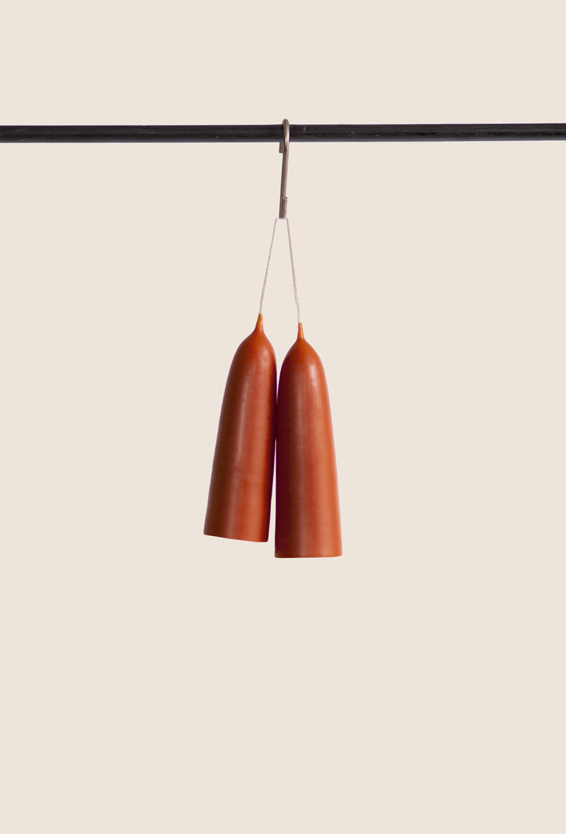 Pair of poppy red colour candles hanging made from beeswax, Ondine Ash