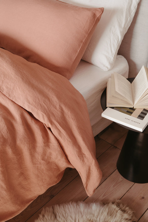 styled shot of bed with bedding in cafe creme, plaster colour for Ondine Ash Falmouth
