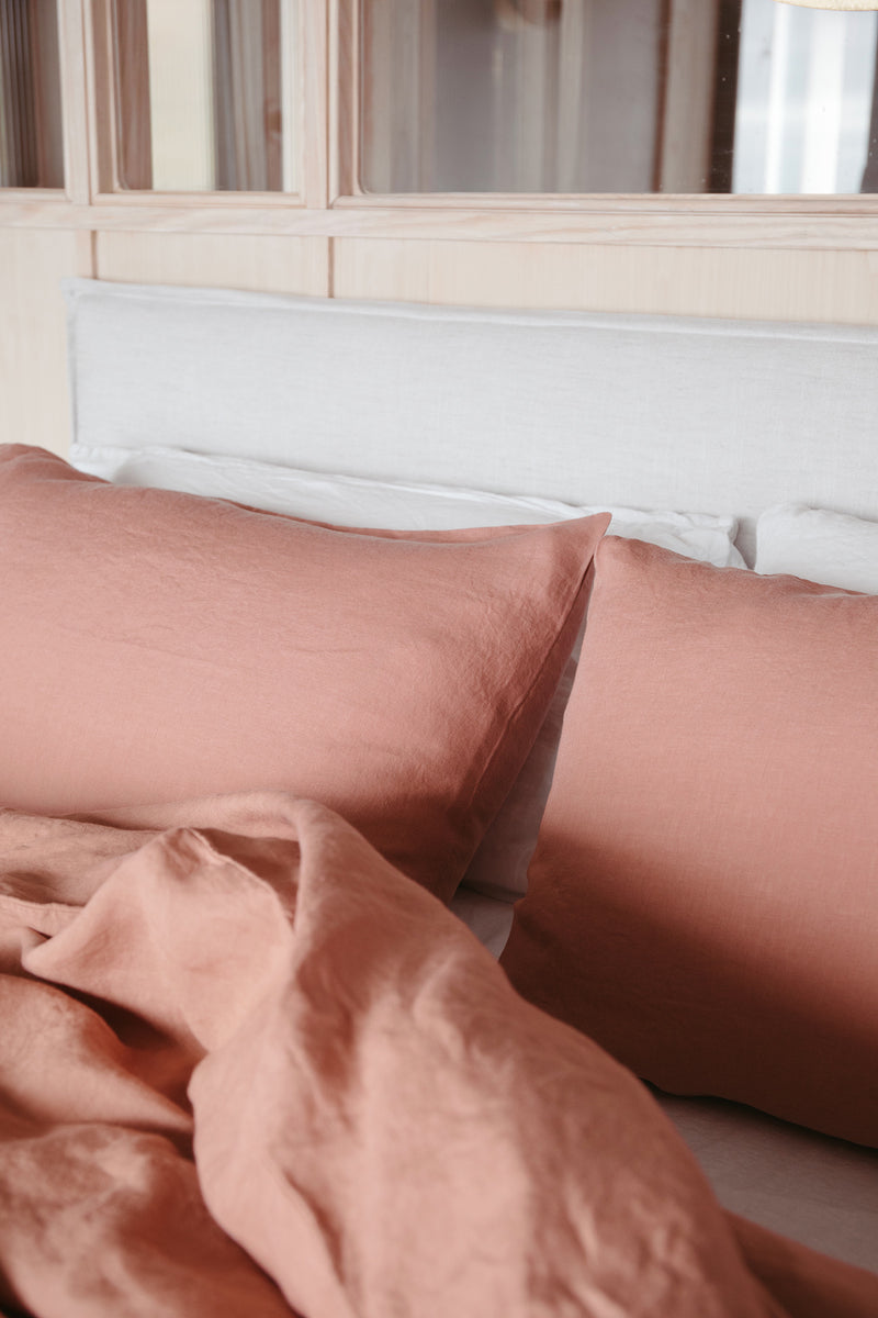 Styled shot of bed with bedding closeup in cafe creme, plaster colour for Ondine Ash Falmouth
