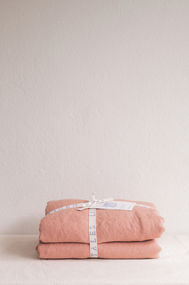styled shot of bed with folded bedding in cafe creme, plaster colour for Ondine Ash Falmouth