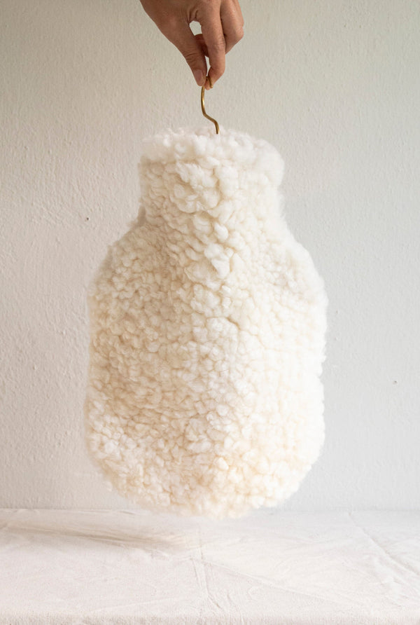 Hot water bottle made from sheepskin and cream colour